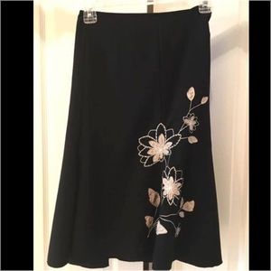 Black A-line skirt with cream appliqué/beading