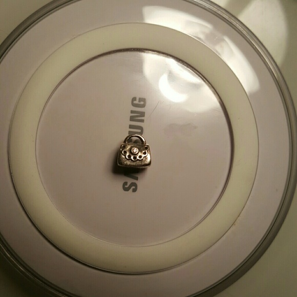 Pandora purse with pink CZ charm