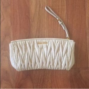 Miu Miu Ivory Matelasse Wristlet Clutch.