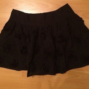 Black skirt with stitched roses