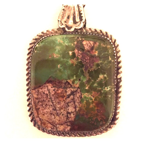 Turquoise and silver southwestern style pendant