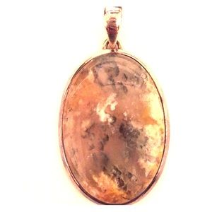 Grey, orange, and silver pendant (stone unknown)