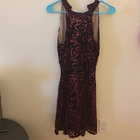 Maroon & black dress with a high neck line
