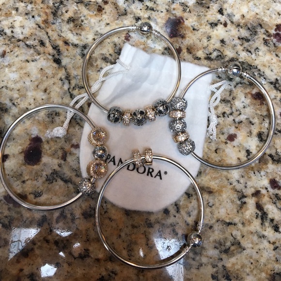 Pandora Bangles w charms. Never worn, like new !