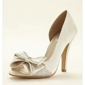 Peep toe heel with bow detail.