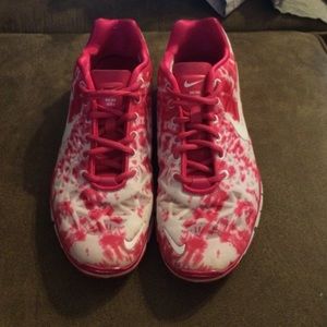 Pink tie-dye Nike running shoes