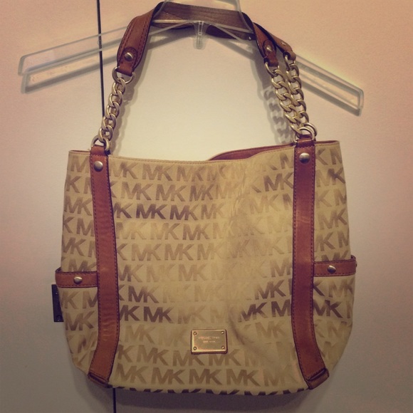 Large brown Michael Kors monogram leather trim bag