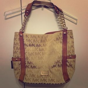 Large brown Michael Kors monogram leather trim bag