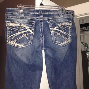 Distressed silver jeans