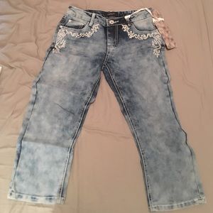 Distressed/acid wash, embroidered denim Capris