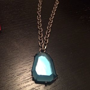 Turquoise gem on a gun metal silver long chain