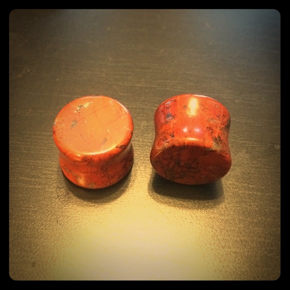 Size 5/8" red turquoise plugs. Never been worn.