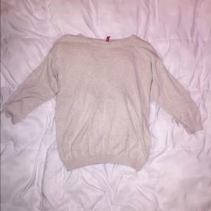 Divided cream sweater.