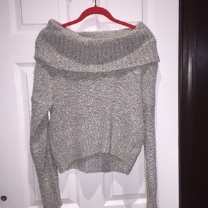 Grey knit turtle neck sweater.