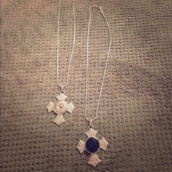 silver flared cross necklace.