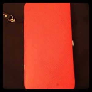 Orange long, thin rigid wallet with locking clasp