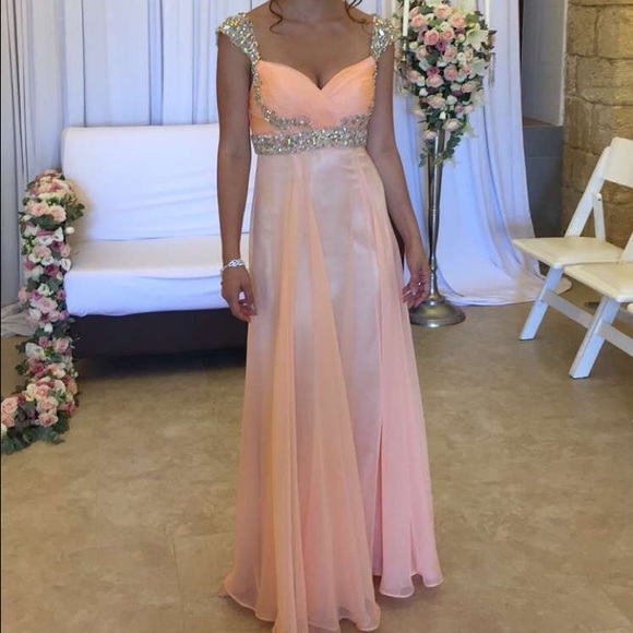 Peach formal gown with stone embellishment. Size 0
