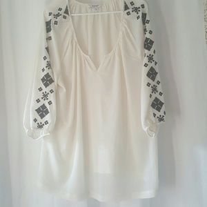 Sheer cream and black top