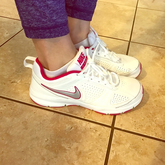 White Nikes with pink detail