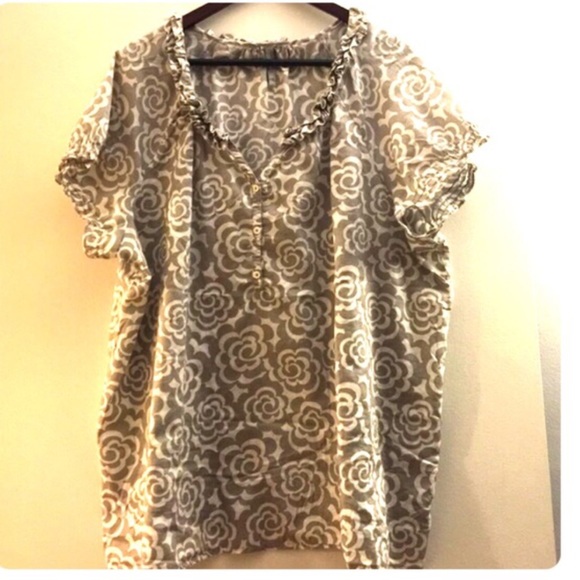 Light gray and white floral print top.