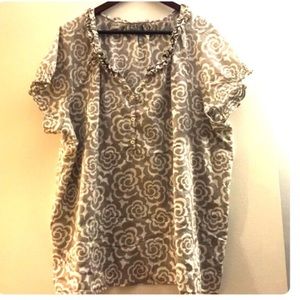 Light gray and white floral print top.