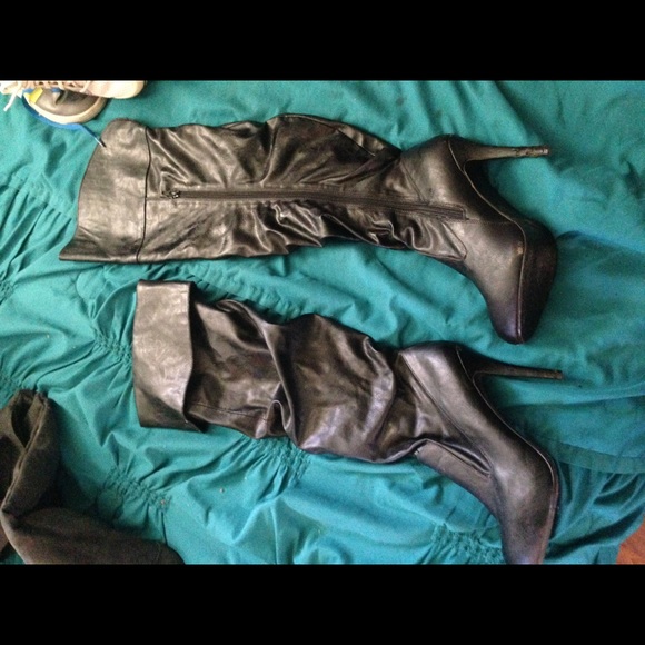 Knee or thigh high black heeled boots
