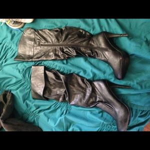 Knee or thigh high black heeled boots