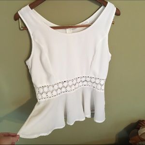 White peplum sleeveless top