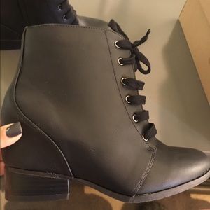 Black bootie w/ small built in heel.