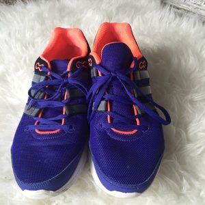 Running adidas sneakers.