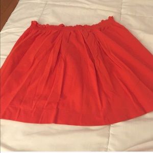 Gently used orange skirt. Elastic waist