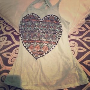 Im selling a light blue top with colorful designs.