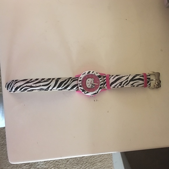 A hello kitty watch with zebra prints😍