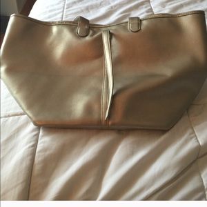 Large gold tote bag. Great for carry on travel