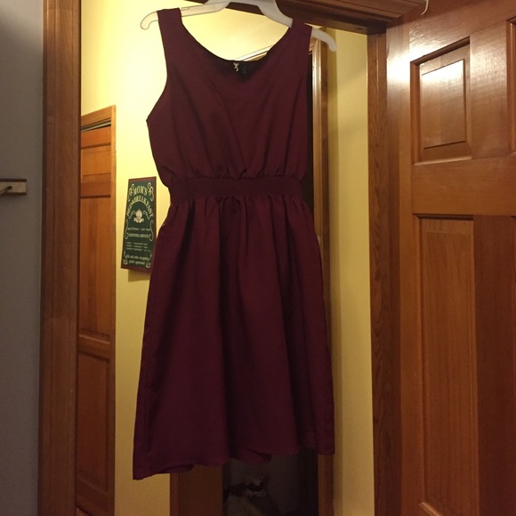 Maroon cinch-waist dress.
