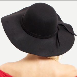 This is a black vintage brimmed hat.
