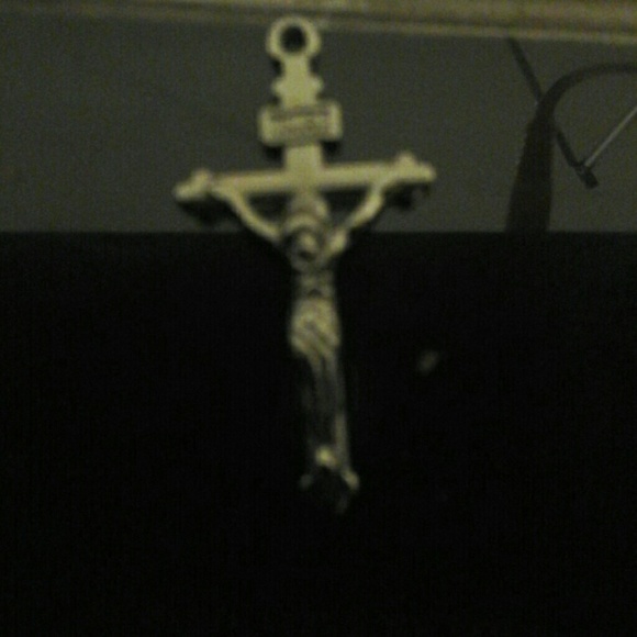 Cross pendent with letters at the  top ..?INIR