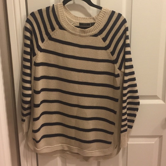 Never worn sweater. Sweater is slit up the sides.
