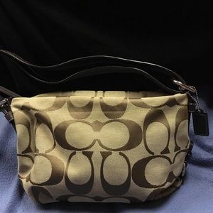 Traditional coach purse
