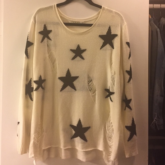 Cute oversized distressed sweater with stars.
