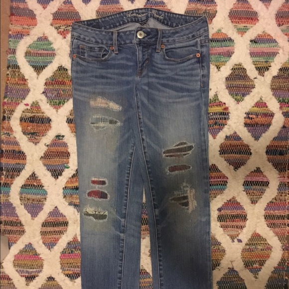 American Eagle patched jeans.