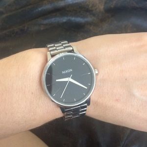 Nixon silver with black face watch