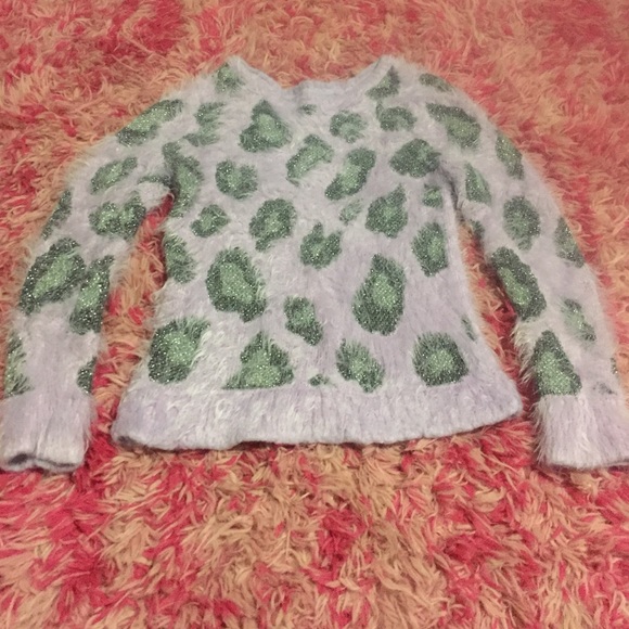 Girls use furry sweater