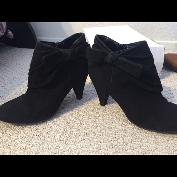 Black booties with bow tie embellishment