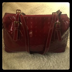 Red patent handbag