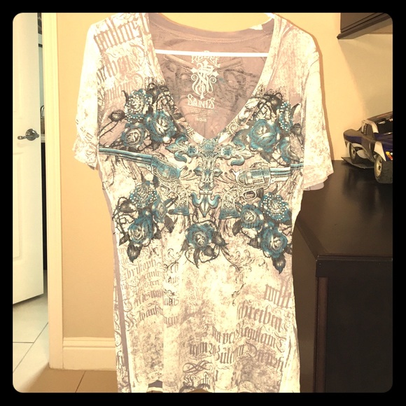 Graphic tee with the bling, cross, and pistols