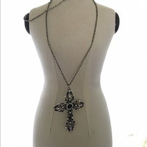 cross encrusted with jet black and clear stones