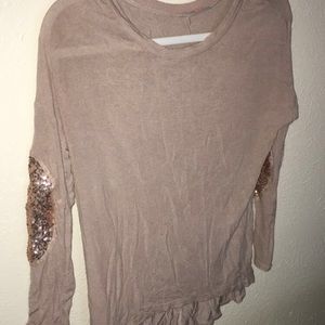 Shirt with sparkly elbow pads