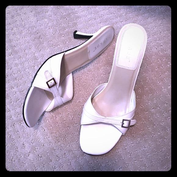 White slide heel with silver buckle, leather upper