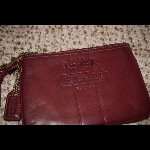 Authentic Maroon Coach wristlet.